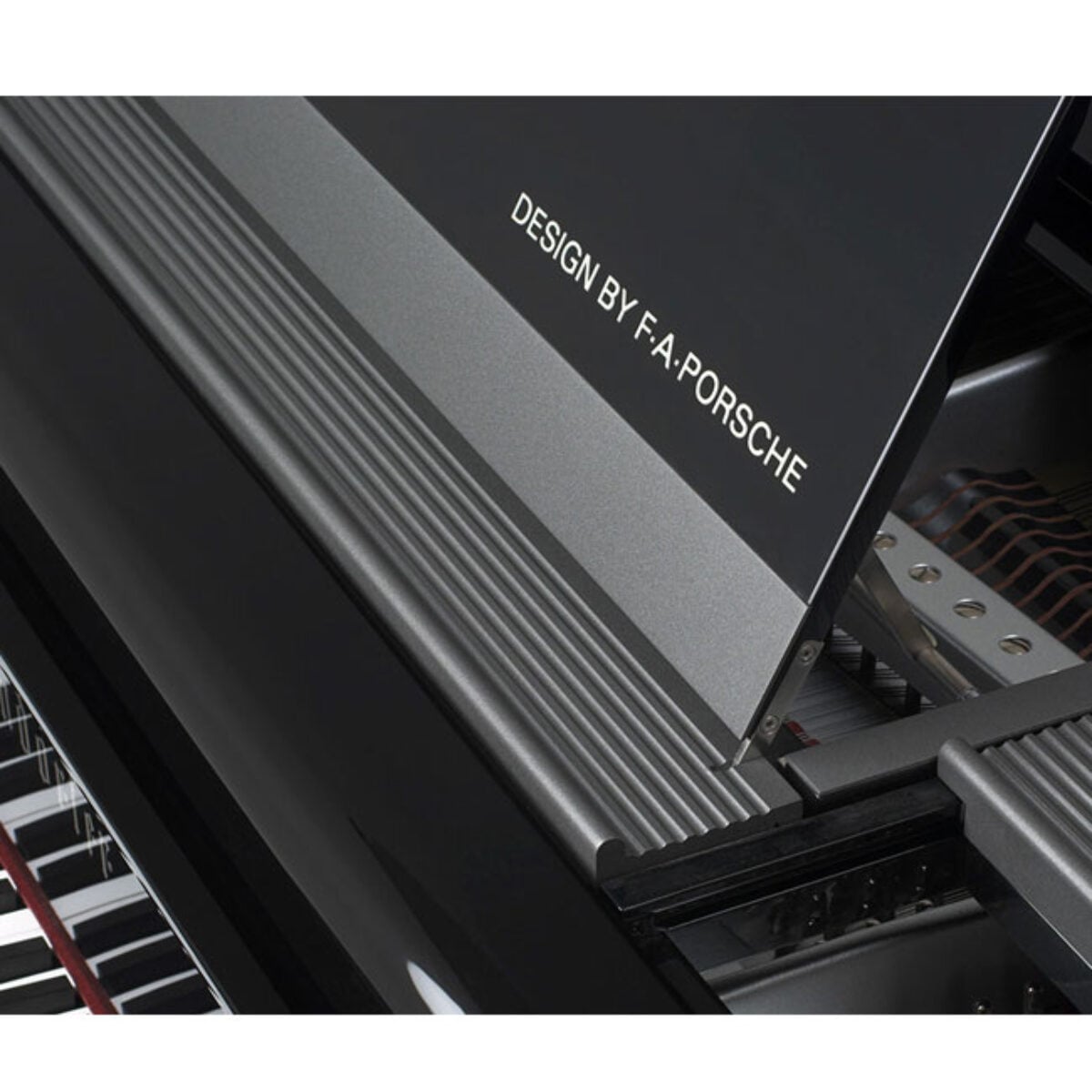 Close-up of F.A. Porsche designed grand piano lid and strings in a polished black finish.