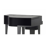 Black digital grand piano with a sleek, modern design in a minimalist setting.