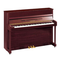 Yamaha upright piano with polished mahogany finish.