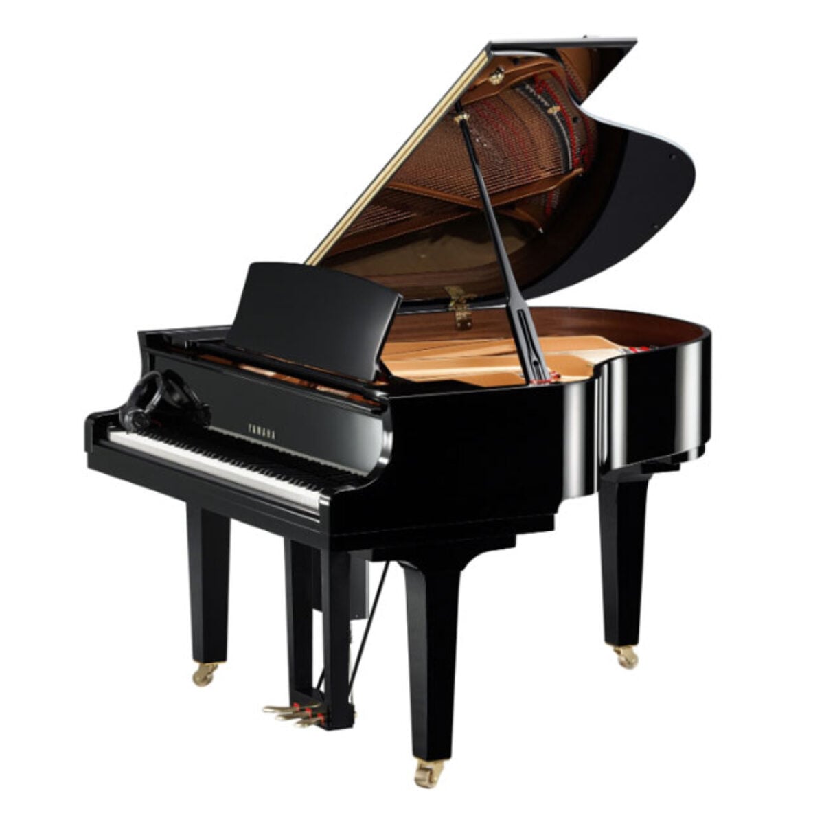 Yamaha black grand piano with open lid in studio setting.