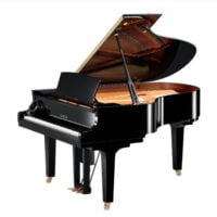Yamaha grand piano with glossy black finish in a showroom setting.