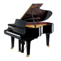 Yamaha grand piano with polished ebony finish and open lid, showcasing the strings and inner mechanics.