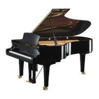 Yamaha black grand piano with open lid in a studio setting.