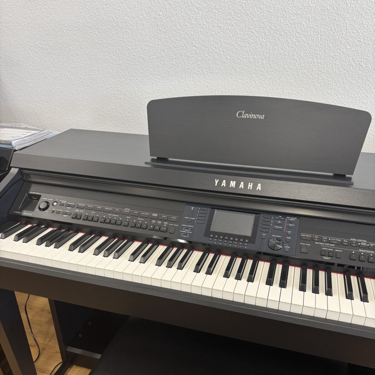 Yamaha Clavinova digital piano with weighted keys and advanced features, perfect for aspiring musicians and professionals.