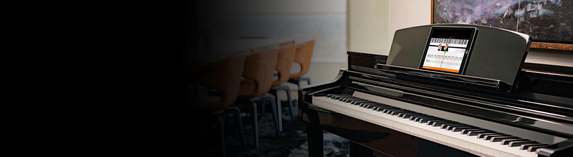 Yamaha Clavinova digital piano with sheet music app on stand, available at Classic Pianos Reno. Perfect for modern pianists.