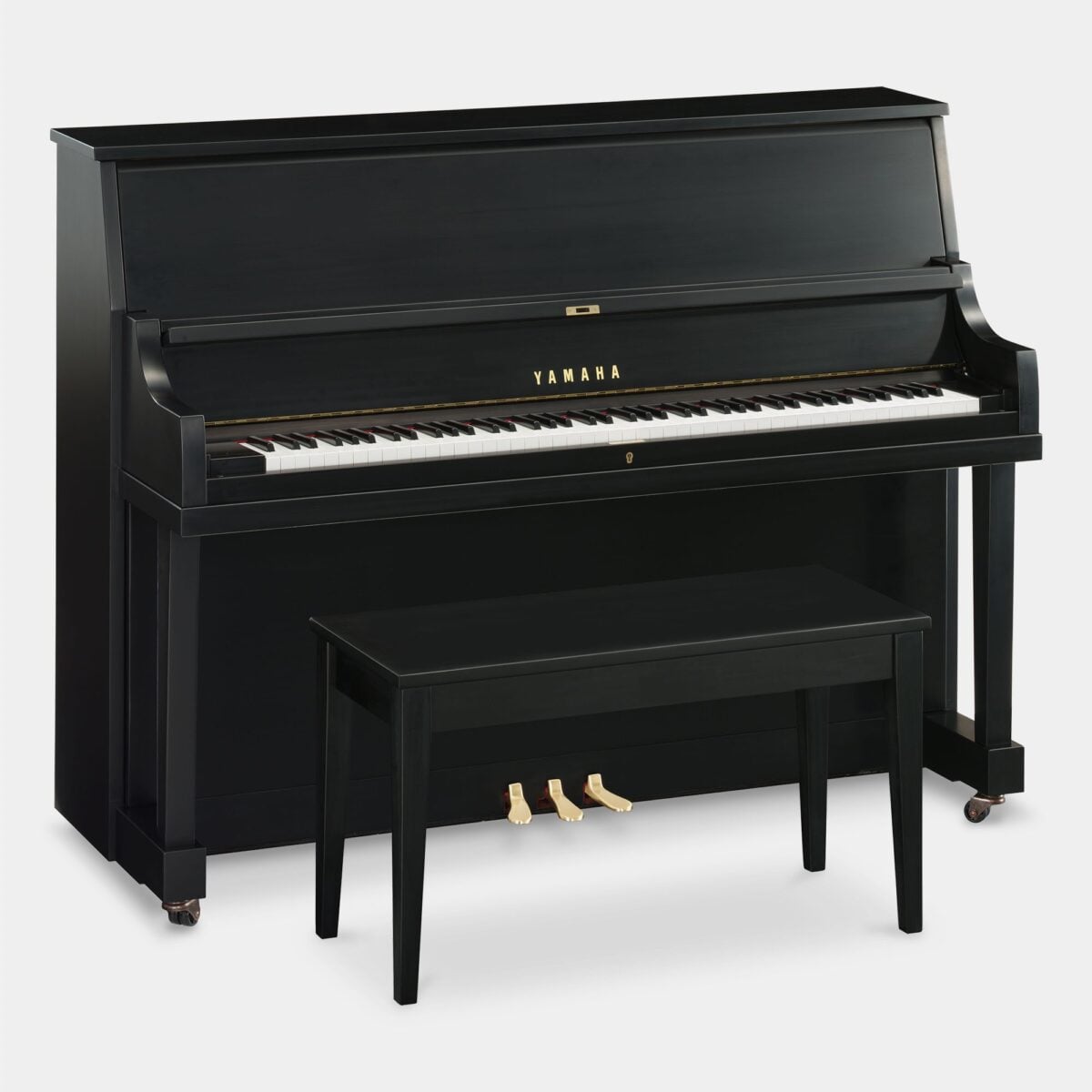 Yamaha upright piano in polished ebony finish with matching bench, highlighting sleek design and craftsmanship.