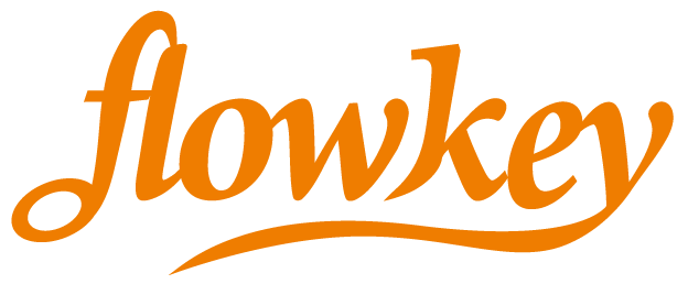 Flowkey logo in orange, an online piano learning app that complements Classic Pianos Reno's offerings.