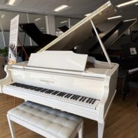 Alt text: Sherman Clay white grand piano with polished finish and plush bench, showcasing premium quality craftsmanship at Classic Pianos.