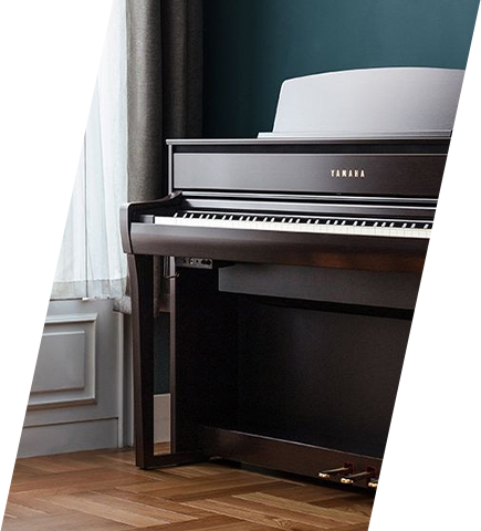 Yamaha digital piano with dark wood finish in a stylish room setting.